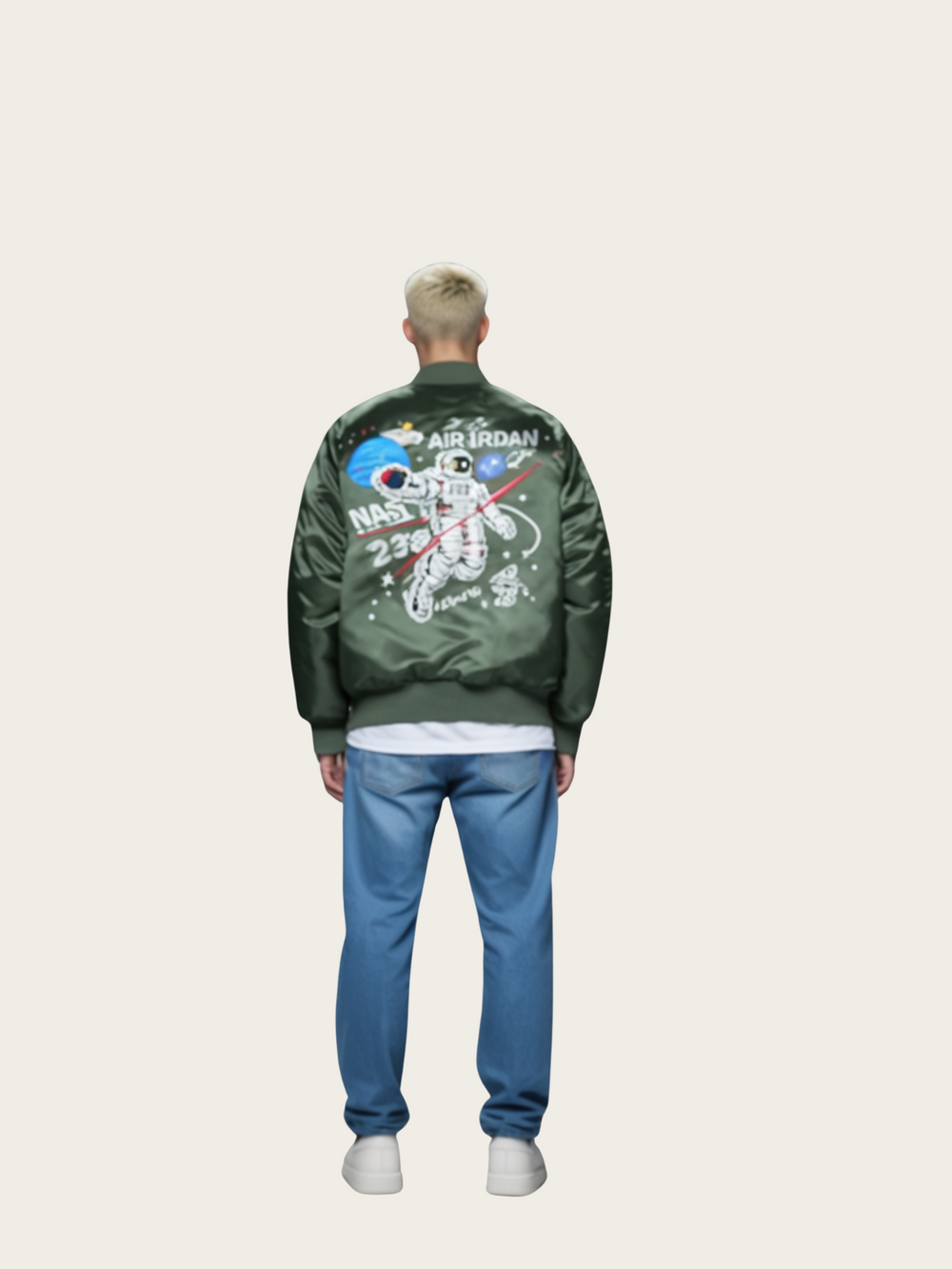 Person wearing a green bomber jacket with NASA and astronaut design on the back, standing against a white background.