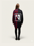 Person wearing a black and red plaid coat with a logo on the back against a white background