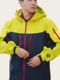Person wearing a yellow and navy jacket with red accents on a white background