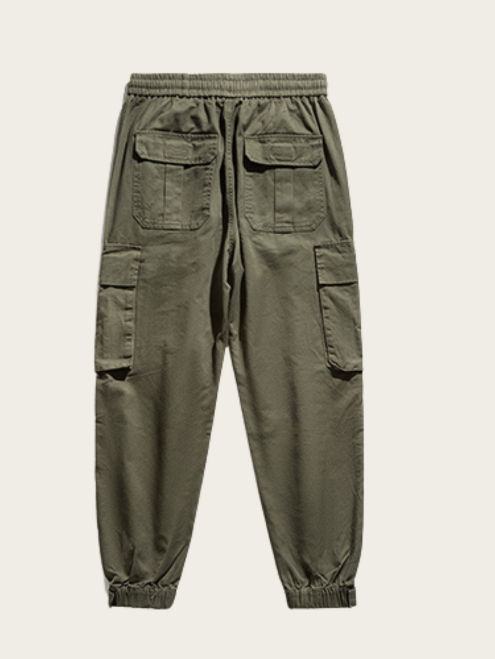 Green cargo pants on a light gray background