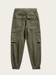 Green cargo pants on a light gray background