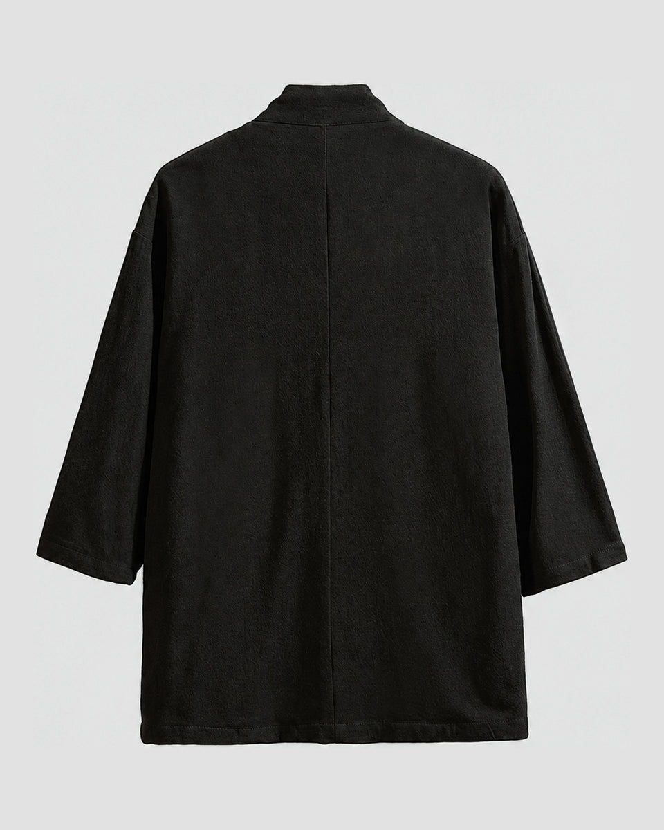 Back of the black linen haori cardigan with a small stand collar and a centre seam