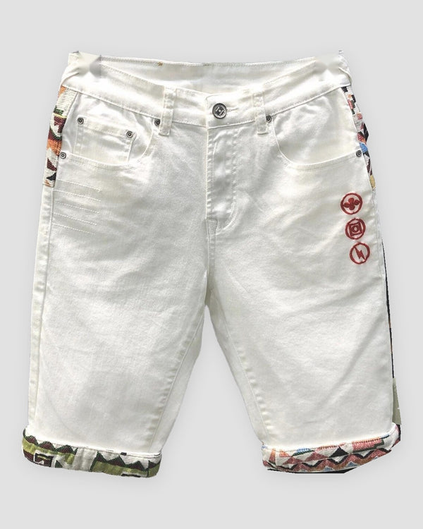 White denim shorts with three red embroidered icons on the thigh and jacquard-lined cuffs, front view