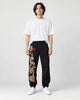 Model wearing the Embroidered Joggers with Pine Tree and Pavilion Design, front view