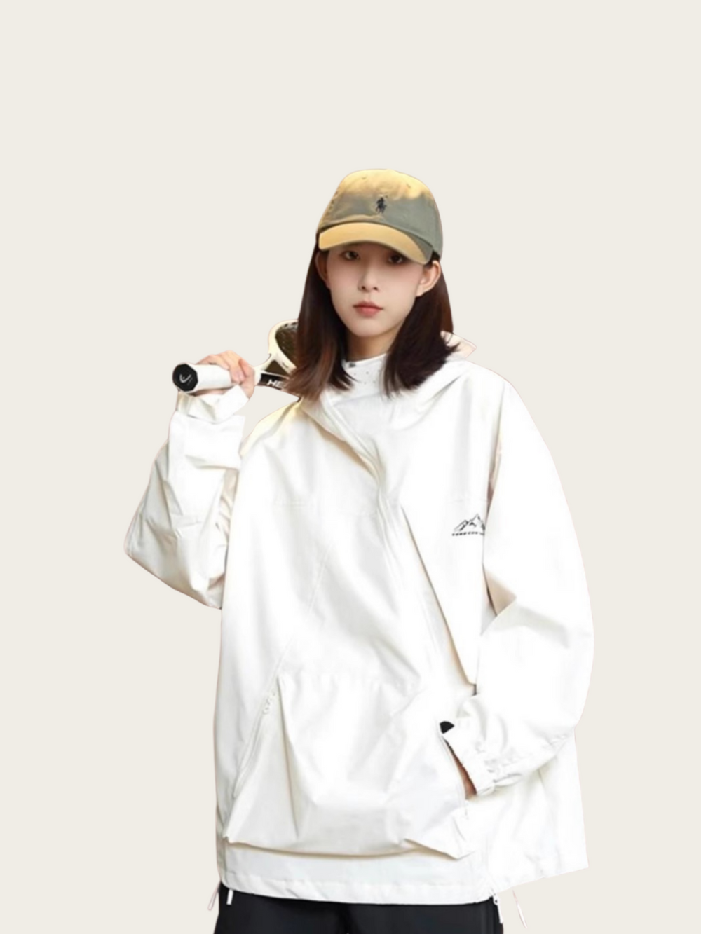 Person wearing a white jacket and cap on a plain background