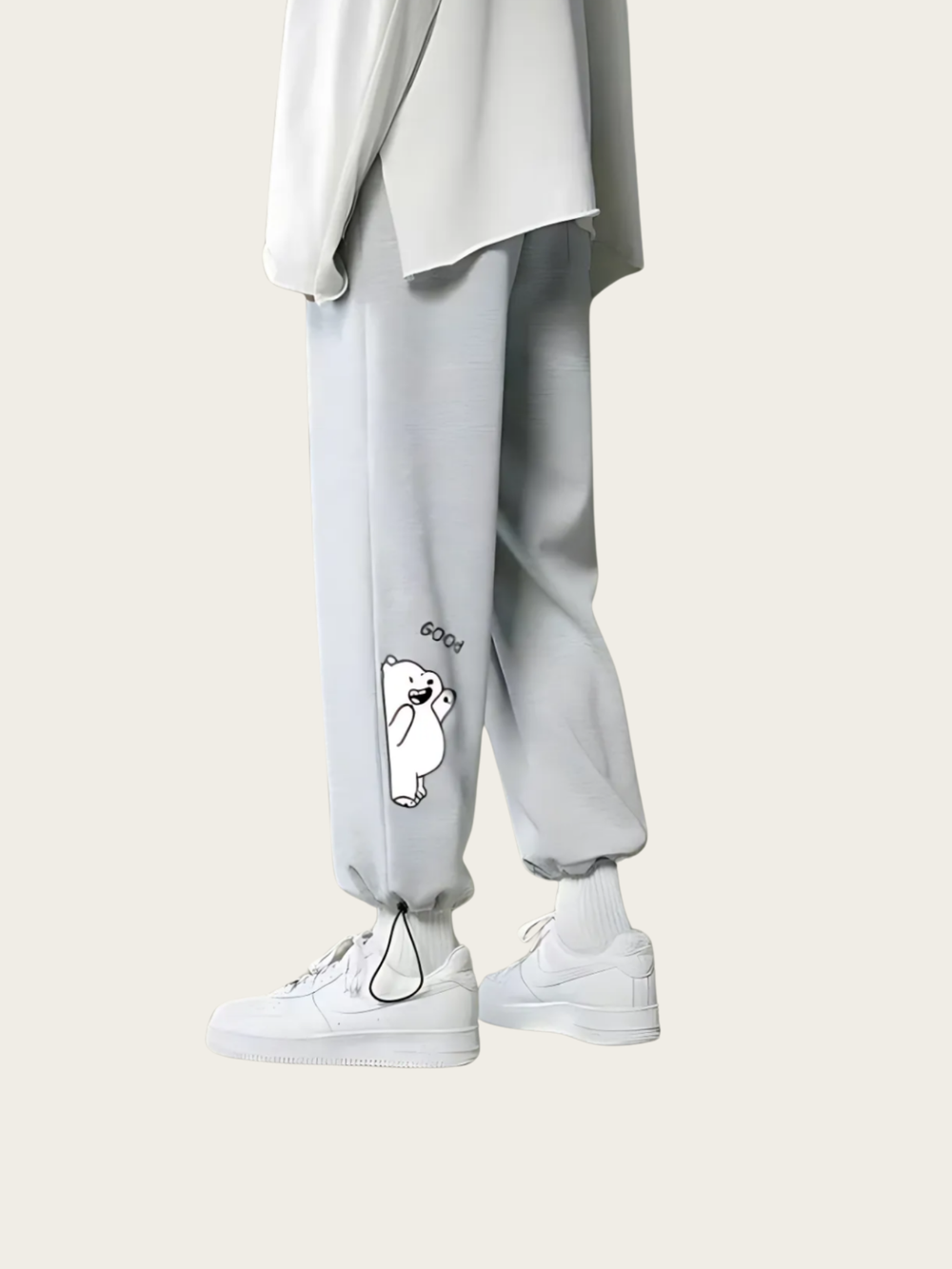 Light gray sweatpants with a small white graphic on a white background