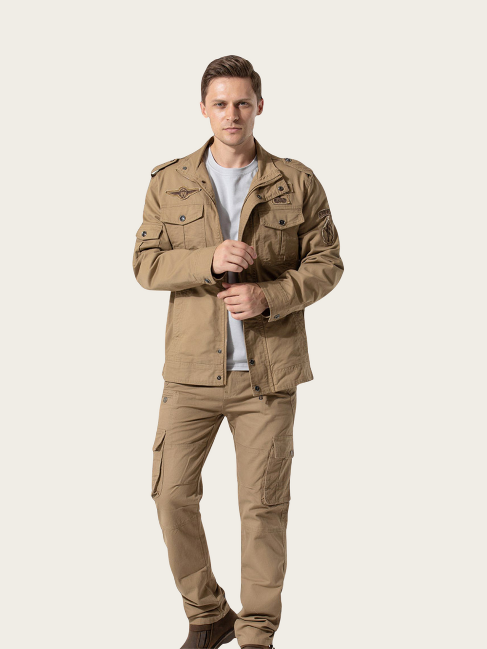 Man wearing a beige jacket and pants on a white background