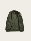 Green jacket on a beige background