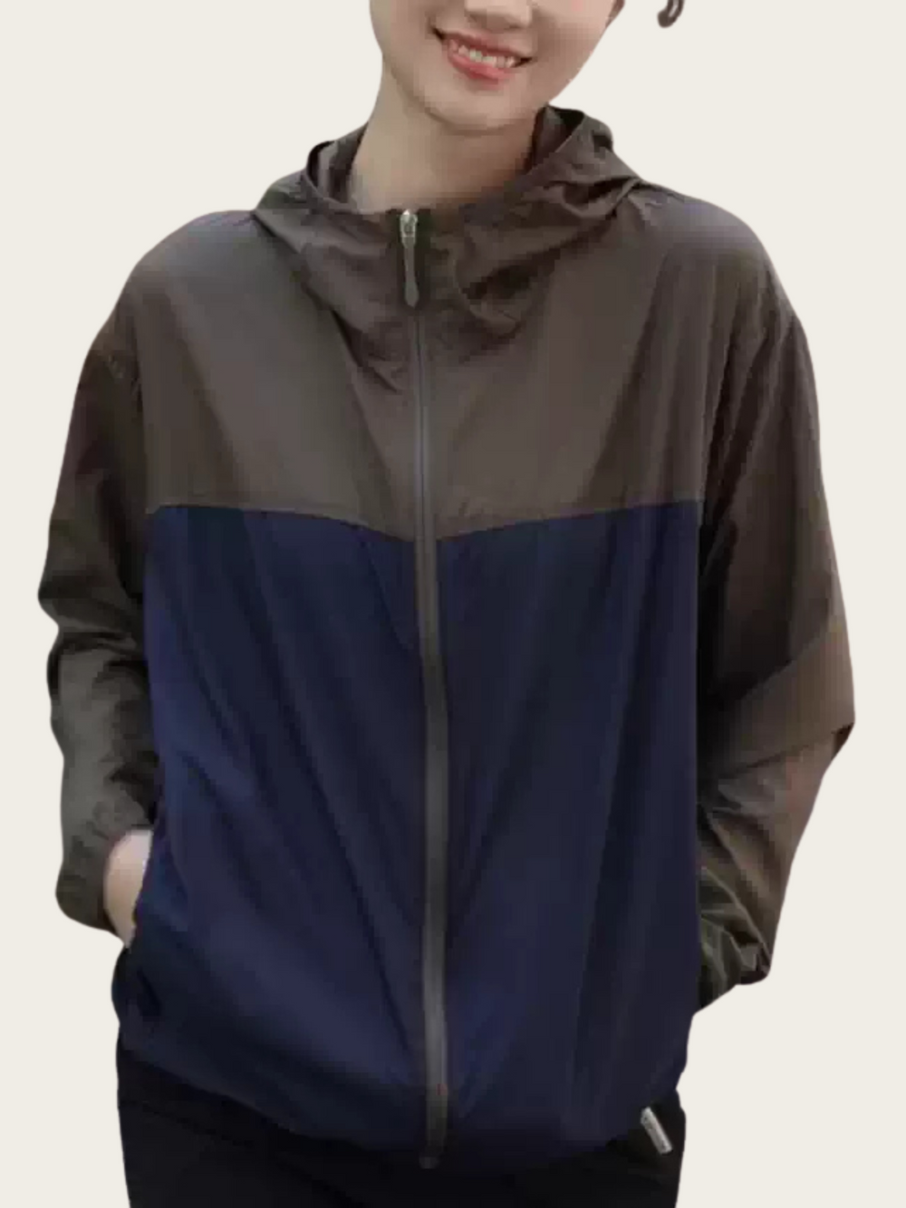 Two-tone jacket with brown and blue colors on a plain background
