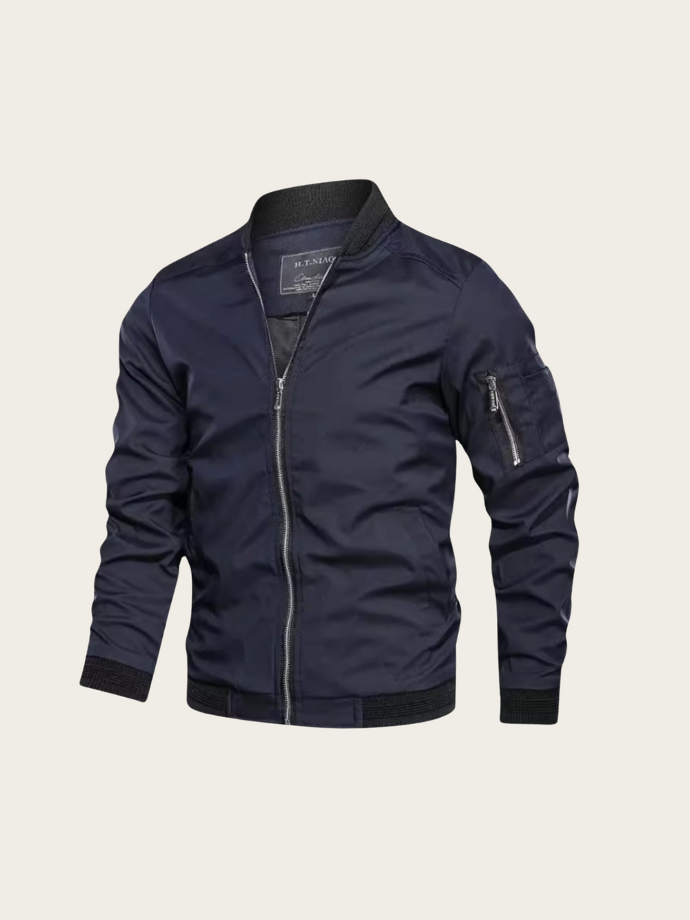 Navy blue bomber jacket on a light beige background