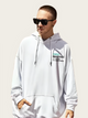Person wearing a white hoodie with text on it against a plain background