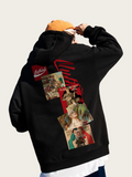 Black hoodie with colorful graphic design on the back, worn by a person.