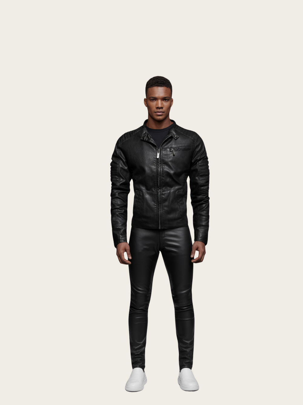 Man wearing a black leather jacket and pants on a beige background