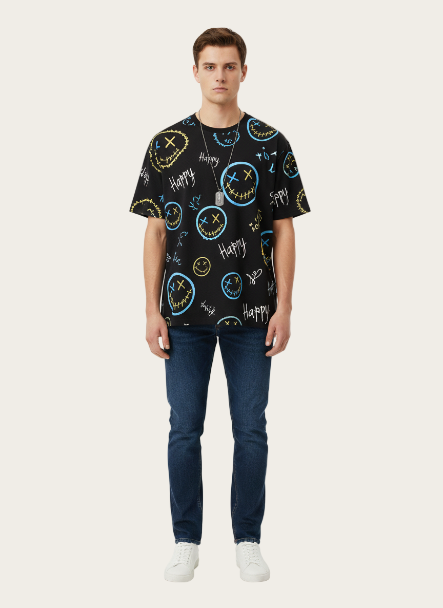 Person wearing a black t-shirt with colorful designs on a white background