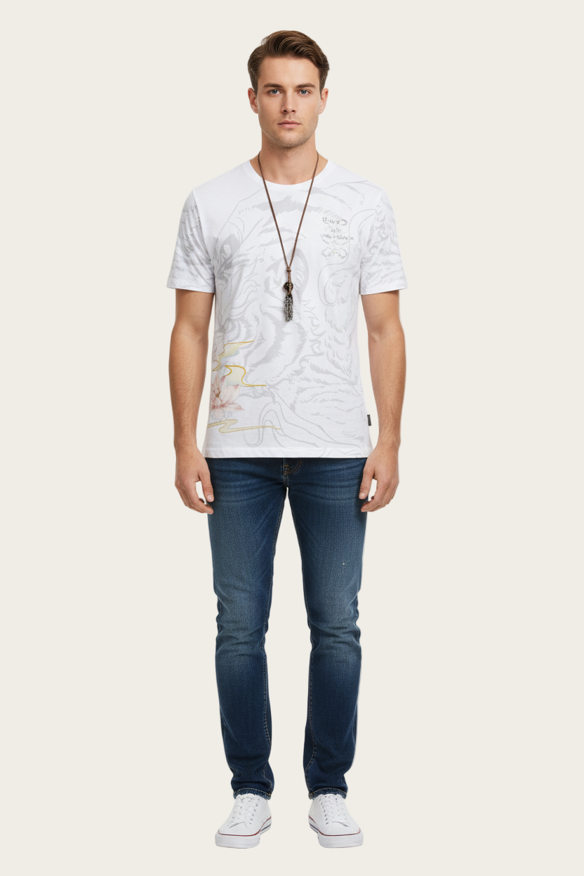 Man wearing a white t-shirt with a map design and blue jeans on a white background