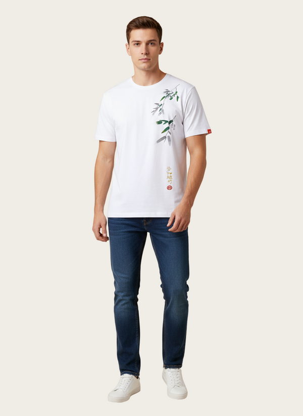 Man wearing a white t-shirt with a design and blue jeans on a beige background