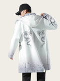 Person wearing a white coat with dragon designs on a plain background