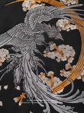 Embroidered design of a phoenix with floral elements on a black background
