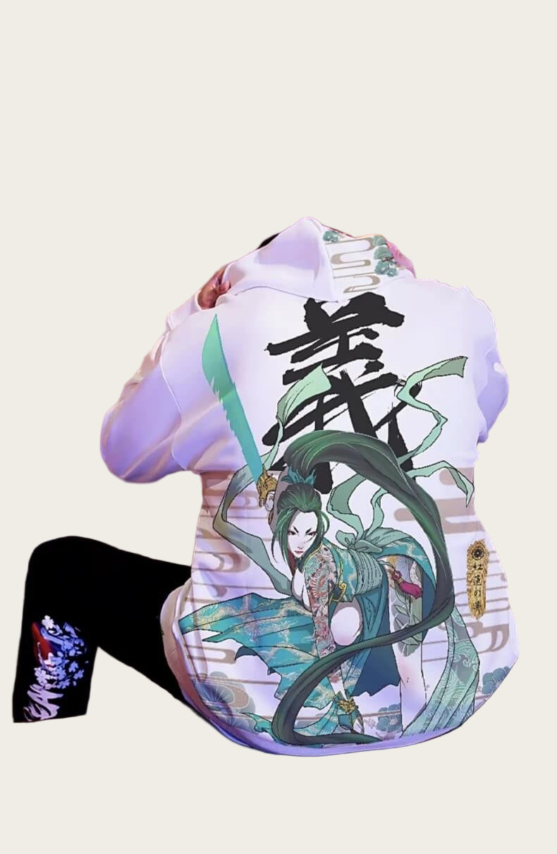 Person wearing a hoodie with a graphic design of a character and text on a blurred background