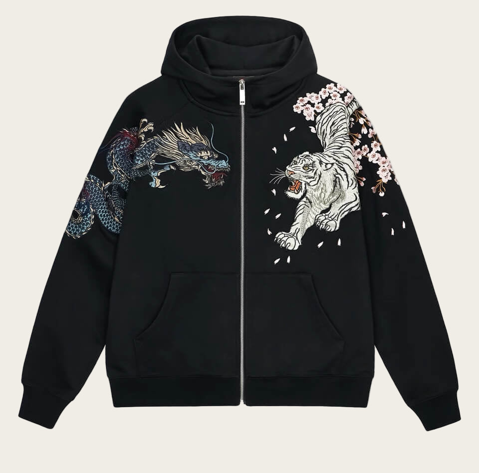 Black hoodie with dragon and tiger designs on sleeves against a white background