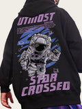 Black hoodie with astronaut graphic and 'Star Crossed' text on the back, against a blurred outdoor background.