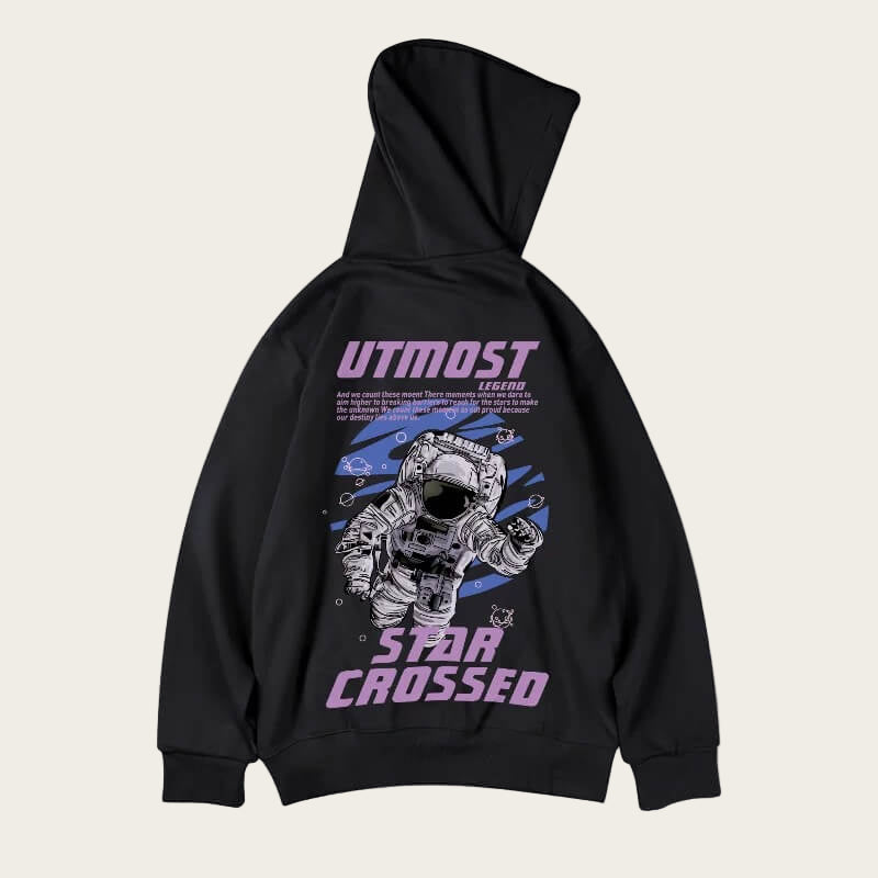 Black hoodie with astronaut graphic and 'UTMOST Star Crossed' text on a white background