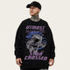 Person wearing a black sweatshirt with an astronaut graphic and 'UTMOST' text on a gray background
