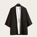 Black kimono-style jacket on a hanger