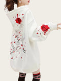 White hoodie with red floral designs 