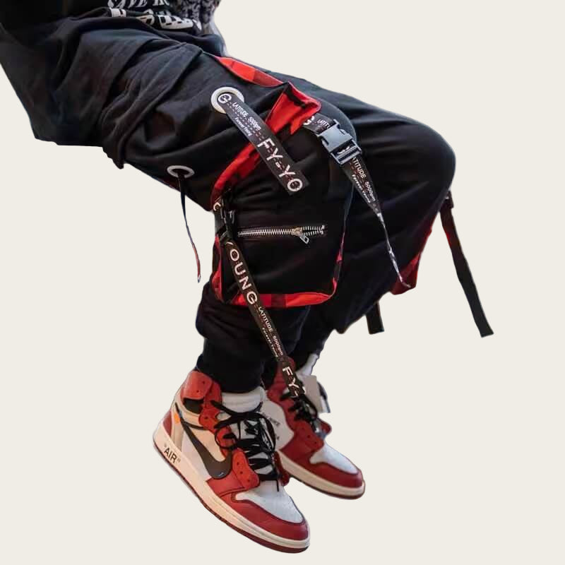 Person wearing red and black sneakers