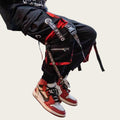Person wearing red and black sneakers