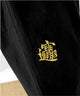 Black fabric with gold embroidery on a white background