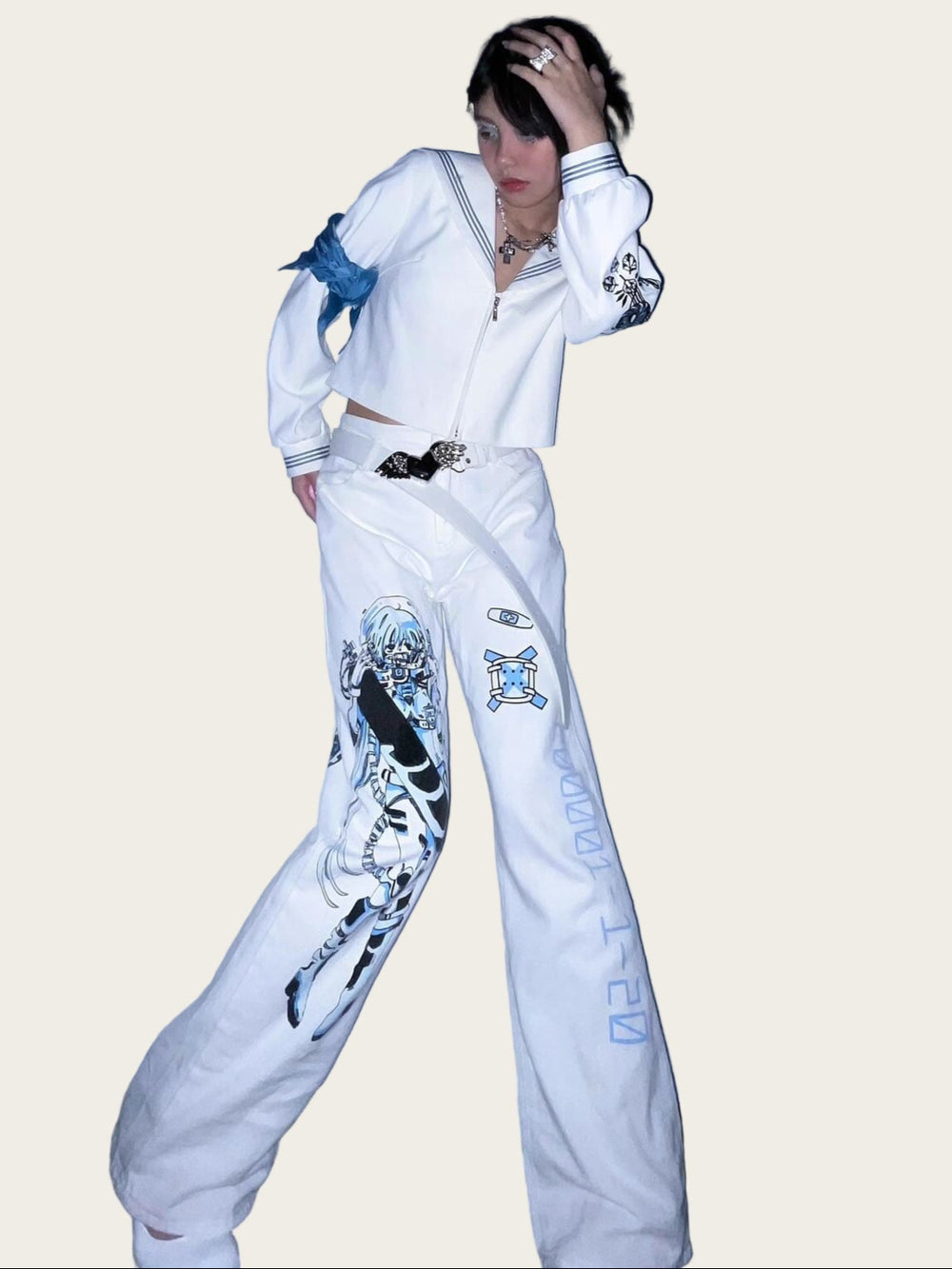 Person wearing a white outfit with graphic designs