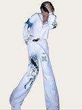 Person wearing a white outfit with graphic designs