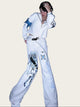 Person wearing a white outfit with graphic designs