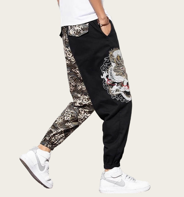 Black pants with white and gray patterns worn by a person 