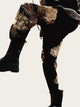 Black pants with gold embroidery on a yellow background