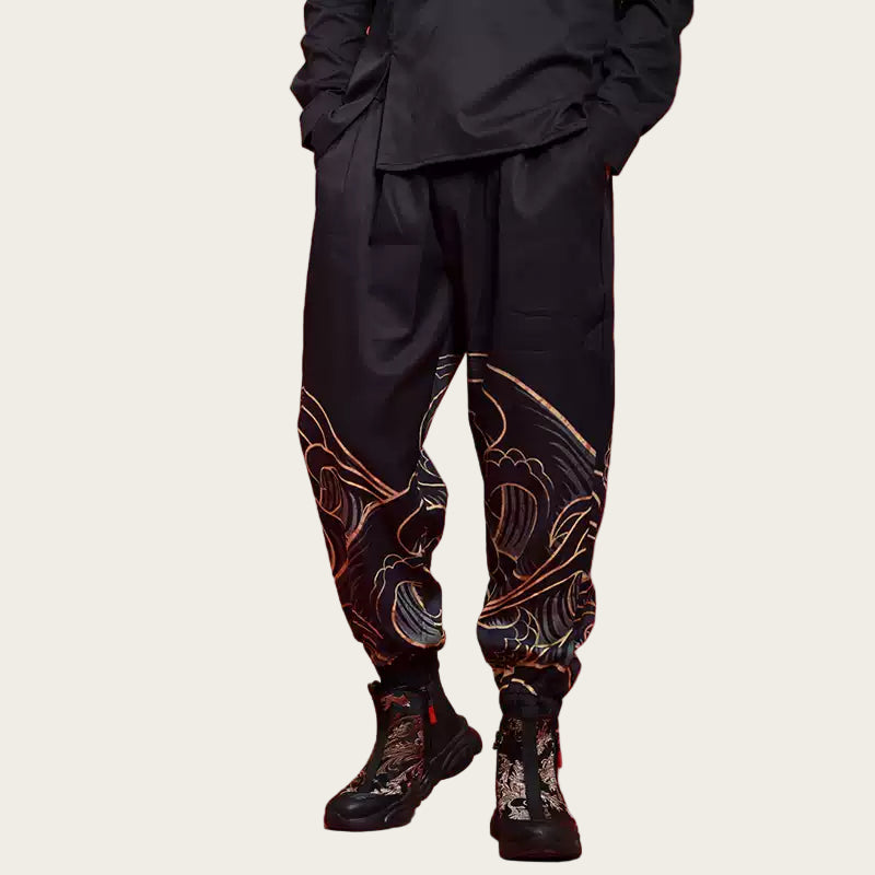 Person wearing black pants with intricate designs