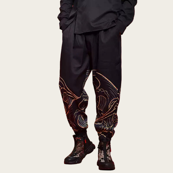 Person wearing black pants with intricate designs