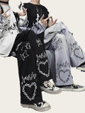 Two people wearing pants with decorative patterns