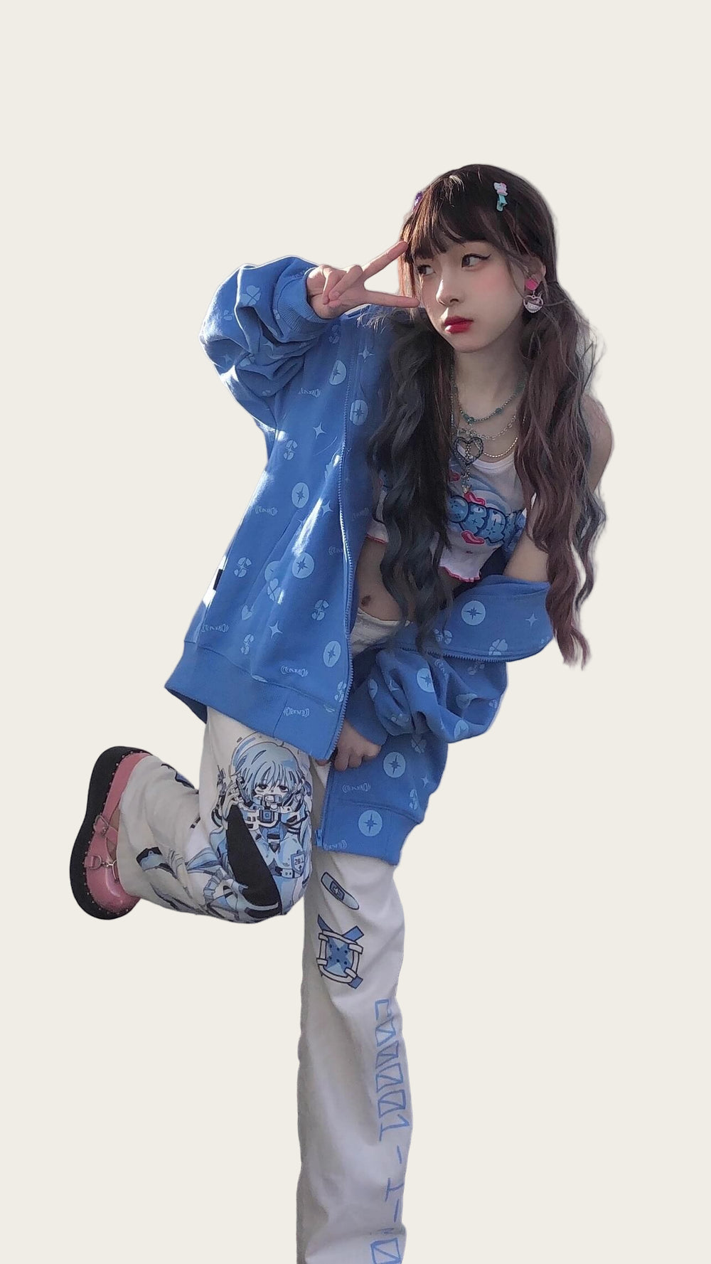 Person wearing a blue jacket and white pants with blue patterns.