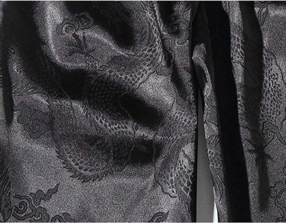 Close-up of black fabric with intricate patterns and textures