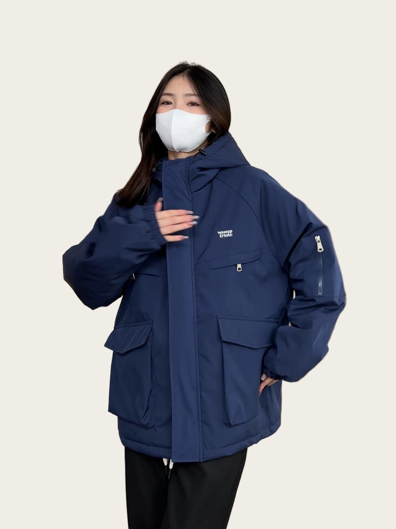 Person wearing a blue jacket indoors