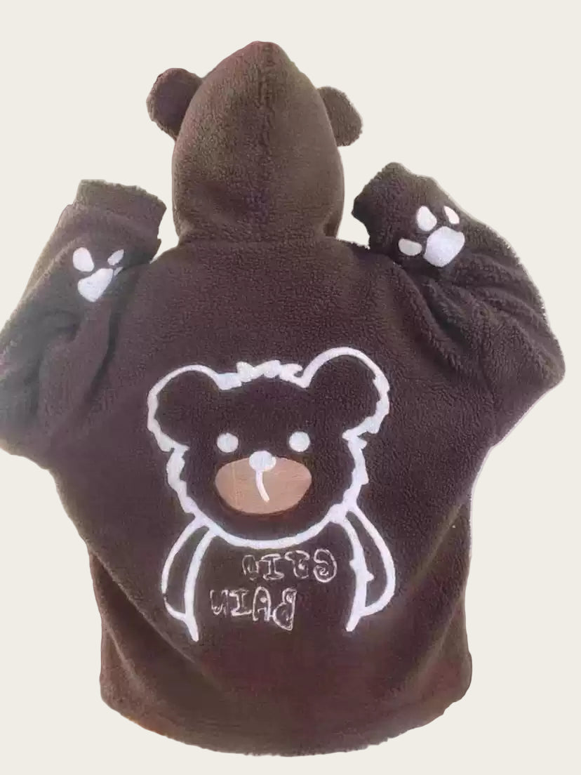 Brown bear-themed robe with paw prints on a chair