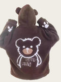 Brown bear-themed robe with paw prints on a chair