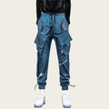 Blue cargo pants worn by a person on a yellow background
