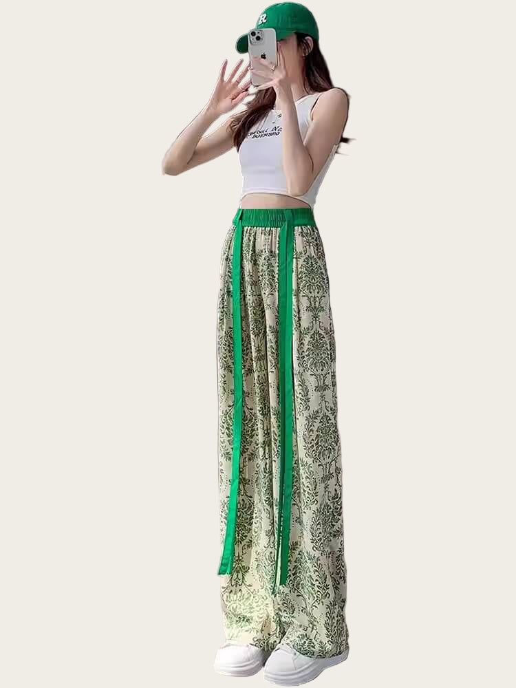 Woman wearing green and white patterned pants.