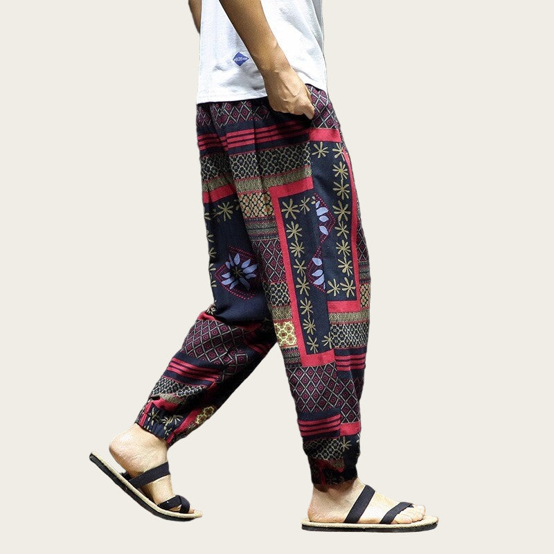 Person wearing colorful patterned pants.