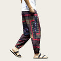 Person wearing colorful patterned pants.