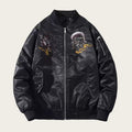 Black bomber jacket with embroidered designs on a white background